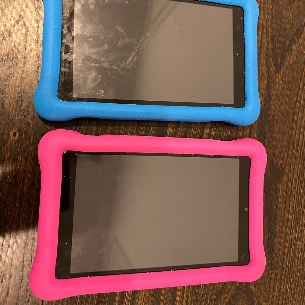 TWO Amazon fire tablets. Used once. 2019 model. W Amazon branded rubber cases.